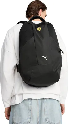 A person wearing a black backpack.