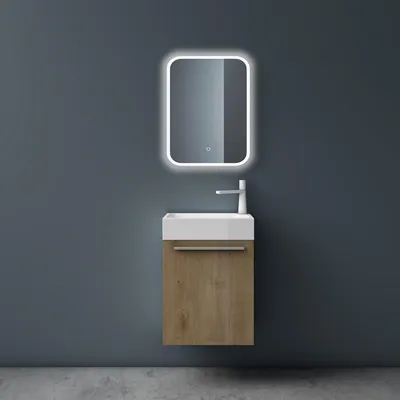 A modern bathroom vanity set with a sink and cabinet against a dark gray wall.