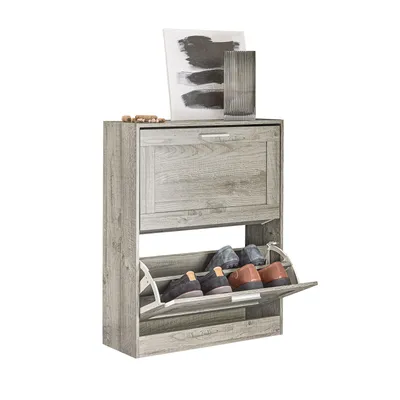 A shoe cabinet with two flip-down drawers is shown against a white background. Decorative items are placed on top of the cabinet.