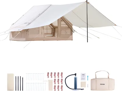 A large, tan and white camping tent is shown from a slightly elevated, diagonal angle. Below the tent, various accessories are laid out in a row on a white background, including tent stakes, ropes, a pump, and a carrying bag.