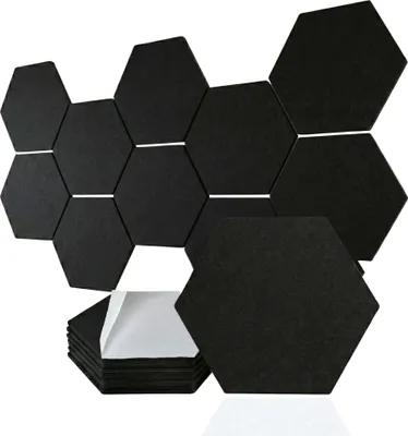 A collection of black hexagonal acoustic panels arranged in a honeycomb pattern, with a stack of panels showing their adhesive backing.