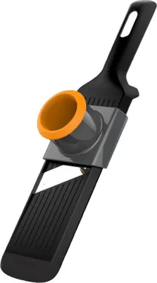 A close-up studio shot of a black and orange vegetable slicer against a white background.