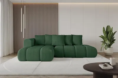 A green sectional sofa is shown in a modern living room setting.