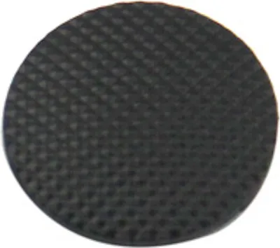 A close-up, top-down view of a black analog stick cap with a textured surface.