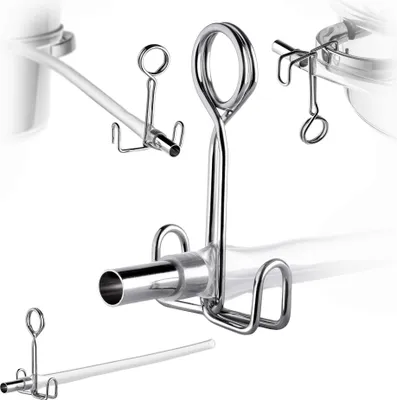 Close-up studio shot of stainless steel juicer accessories, including a hose and clips, against a white background.