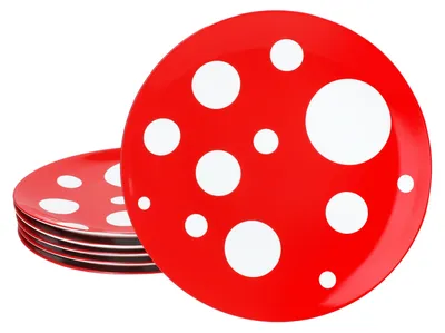 A stack of red plates with white polka dots.