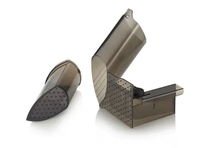 Two transparent gray plastic food slicer attachments are shown against a white background. One is closed and pointed, the other is open and hinged.