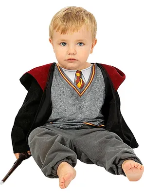 A baby dressed in a Harry Potter costume, sitting down and holding a wand.