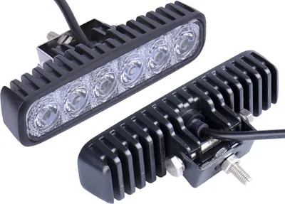 Two black LED work lights with silver mounting hardware are shown against a white background.