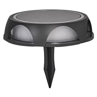 A dark gray outdoor solar lamp with a spike for ground insertion, shown against a white background.