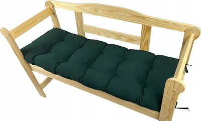 A dark green cushion on a wooden bench.