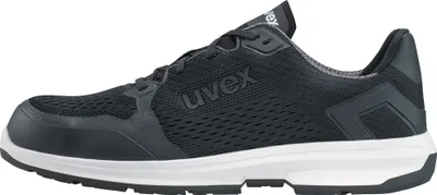 A side view of a black uvex safety shoe with a white sole.