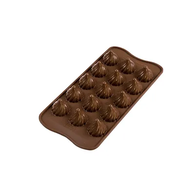 A chocolate mold with 16 individual cavities, each shaped like a flame or a swirl.