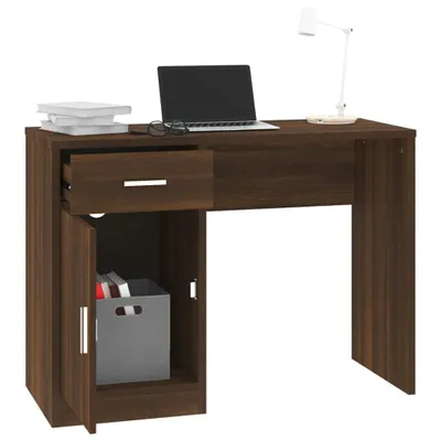 A brown wooden desk with a laptop, books, a lamp, and storage compartments.
