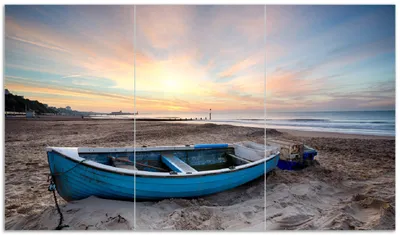 Produktbild von Wallario Herdabdeckplatte aus Glas, Größe 90 x 52 cm 3-teilig, Motiv Fischerboot am Strand bei Sonnenuntergang