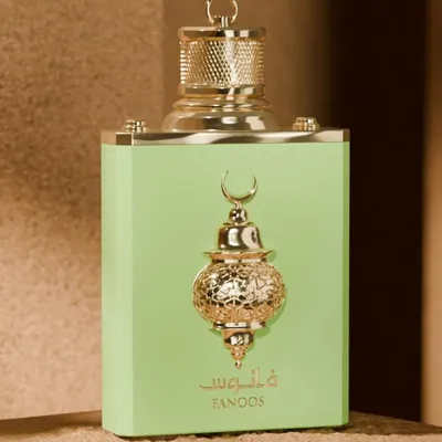 A product shot of a perfume bottle with decorative elements.