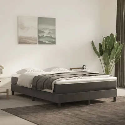 A bedroom scene with a bed as the focal point.