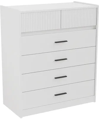 A white dresser with six drawers and a fluted design on the top two drawer fronts. The dresser has black handles.