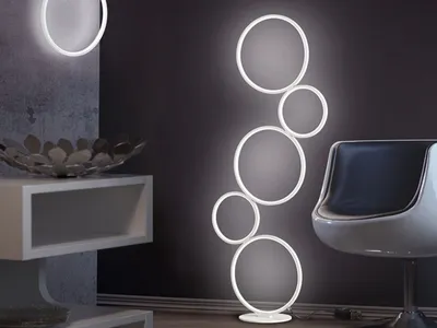 A modern living room with a floor lamp and a shelf.