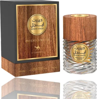 A product shot of a perfume bottle and its box, presented on a white background with reflections.