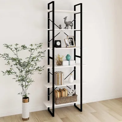 A tall, narrow bookshelf with white shelves and a black metal frame, decorated with various items, stands against a white wall next to a potted plant.