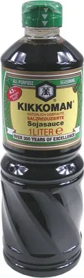 A bottle of Kikkoman soy sauce on a white background.