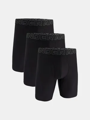 Three black boxer shorts are arranged in a staggered formation against a white background.