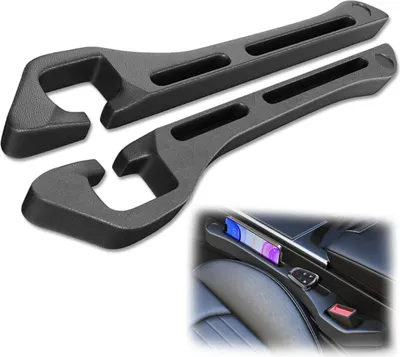 Two black car seat gap fillers are shown against a white background. A small inset image shows the gap fillers installed in a car's center console, holding a smartphone and a car key.