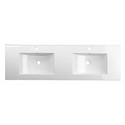 A top-down view of a white ceramic double sink countertop.