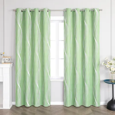 Two green curtains with a white wavy pattern hang on a curtain rod in front of a window. To the left is a white fireplace mantel with a calendar. To the right is a small blue table with a vase of flowers.