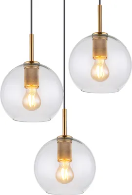 Three pendant lights with clear glass globes and gold-colored metal accents, each containing a visible light bulb.