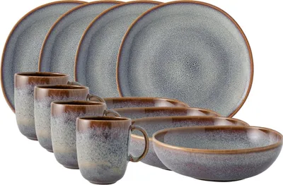 A set of stoneware dishes and mugs with a speckled gray and brown glaze.