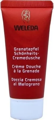 A red tube of Weleda shower cream with white text and a white cap.