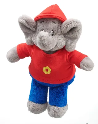 A plush toy elephant wearing a red shirt and blue pants, with a red hat on its head.