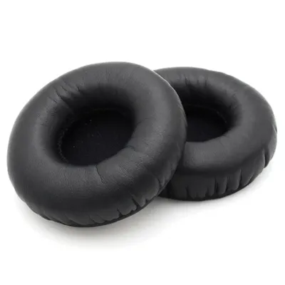 Two black headphone ear pads are shown on a white background.
