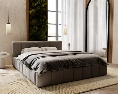 A modern bedroom with a large upholstered bed as the focal point, featuring a vertical garden wall and sheer curtains.