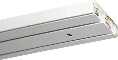 A close-up, angled view of a white curtain rail profile, showing its hollow internal structure.