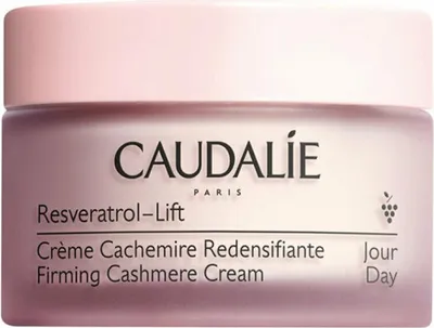 A close-up studio shot of a Caudalie Resveratrol-Lift Firming Cashmere Cream jar.