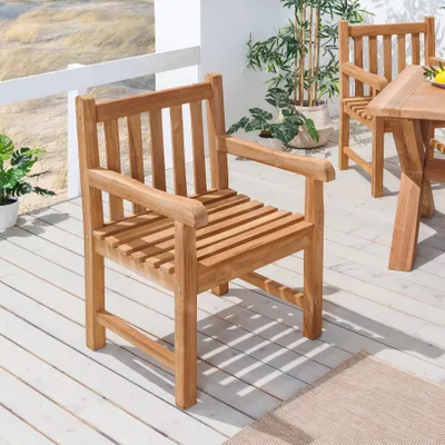 Outdoor patio setting with teak furniture.