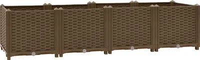 A long, brown, modular raised garden bed.