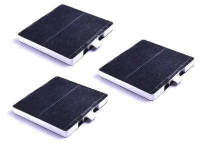 Three square electronic components with black tops and white sides are arranged diagonally on a white background.