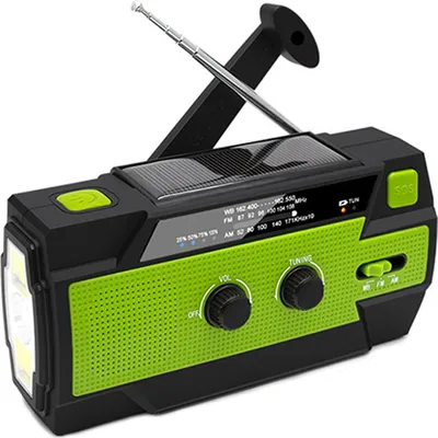 A black and green emergency radio with a solar panel and flashlight.