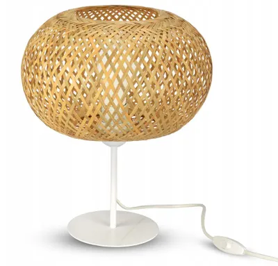 A table lamp with a woven bamboo shade and a white metal base and stem, shown against a white background.
