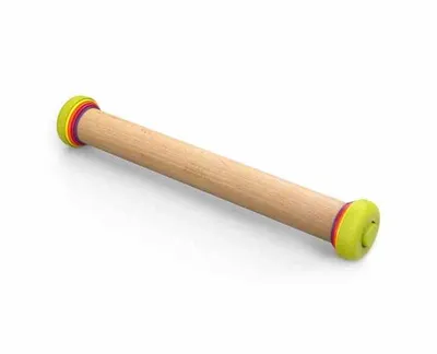 A wooden rolling pin with colorful rings on the ends, set against a white background.
