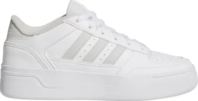 A studio shot of a white Adidas sneaker with gray accents.