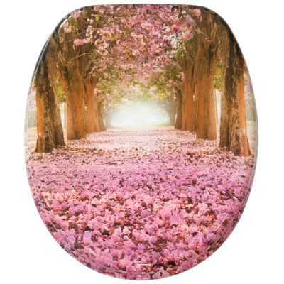 A toilet seat lid with a printed image of a pathway lined with trees and covered in pink flowers.