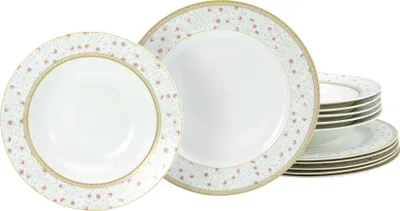 A set of white porcelain plates with a delicate floral pattern and gold trim, stacked and arranged on a white background.