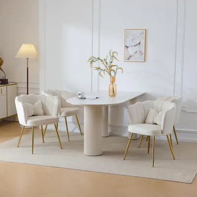 A dining set with four chairs and a table in a well-lit room.