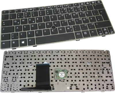 A top view of a laptop keyboard and its disassembled components.