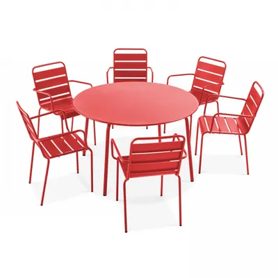 A red metal garden table and six chairs.